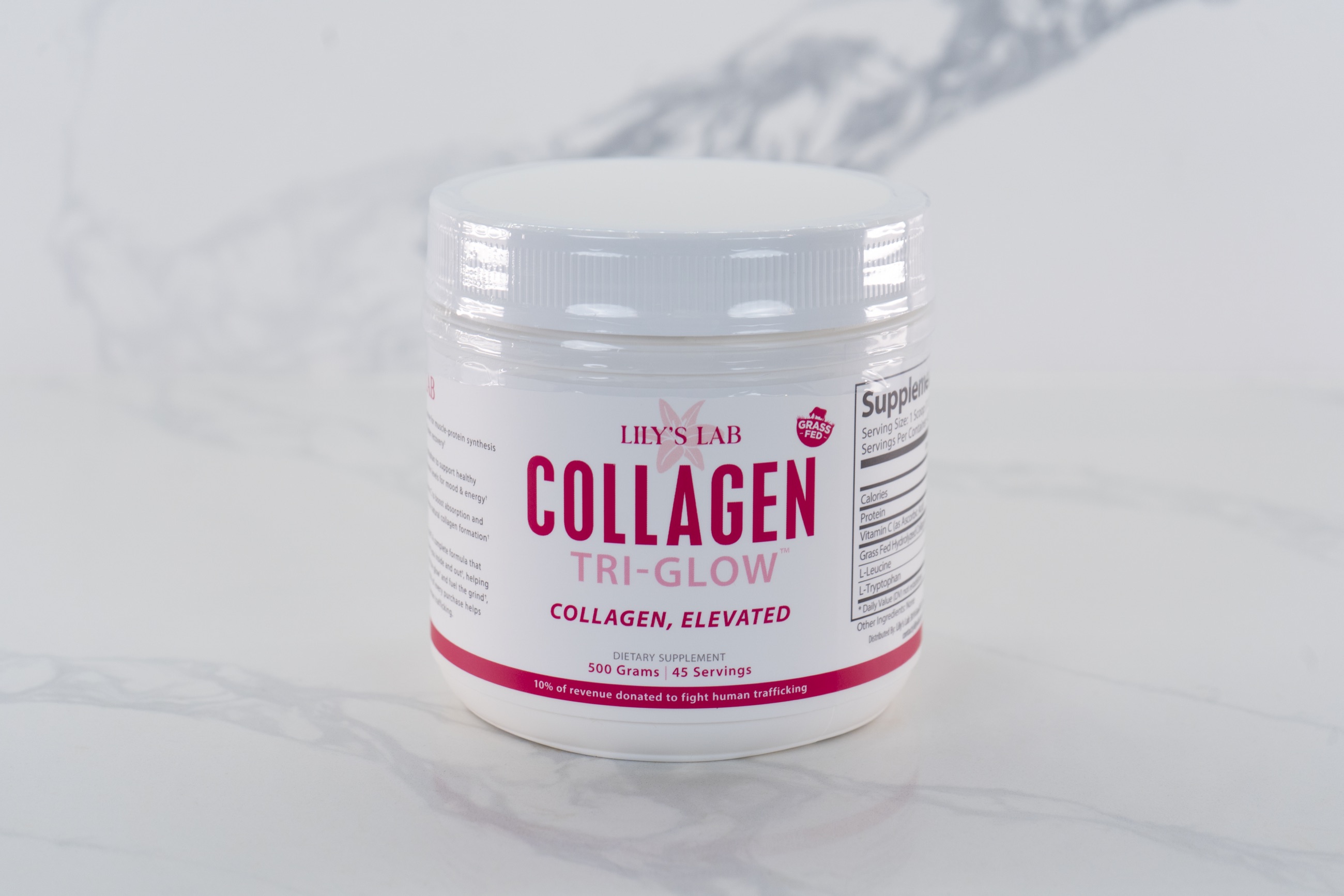 Lily's Lab Collagen Tri-Glow on a marble surface
